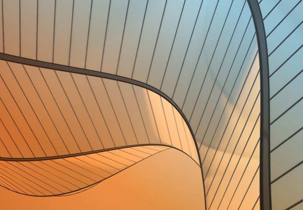 Abstract architectural panels with curved, overlapping lines in warm orange and cool blue gradients.
