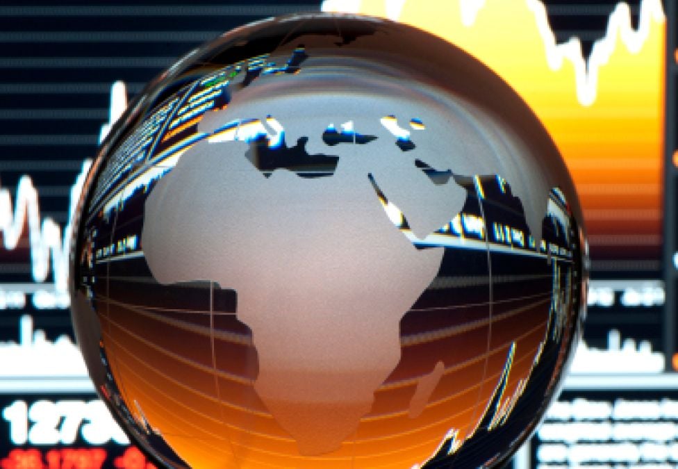 A globe posed on a series of charts.