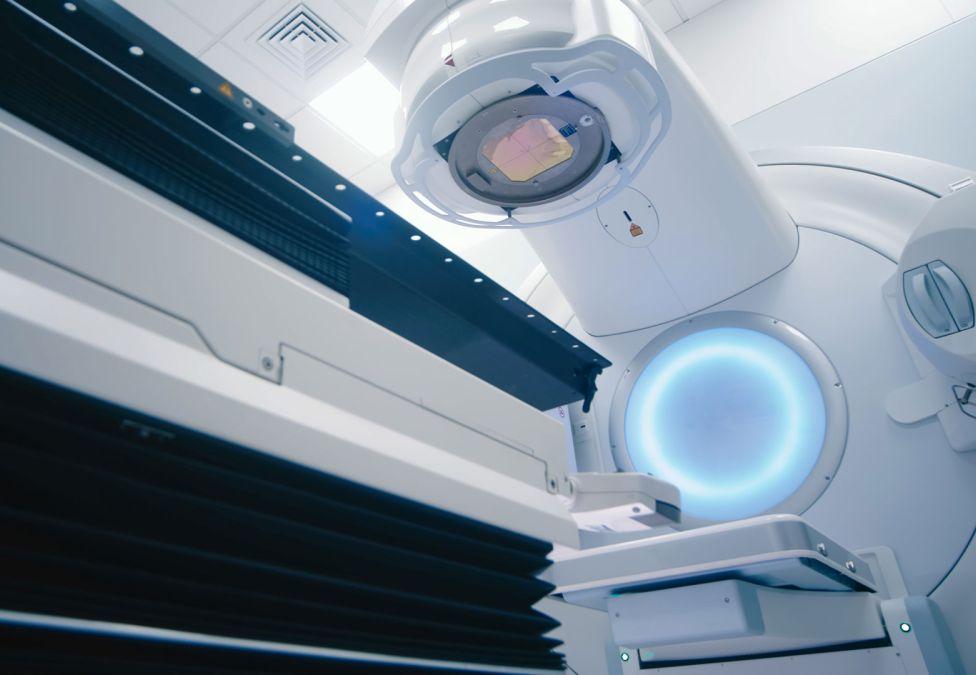 Medical linear accelerator used for radiation therapy in a treatment room.