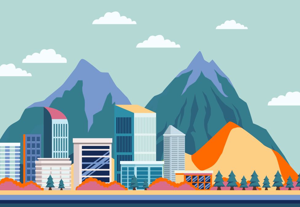 An image of a city surrounded by mountains.