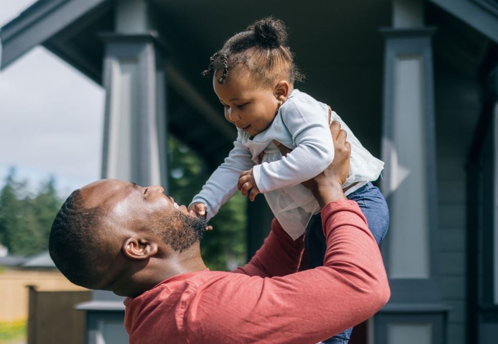 Abstract 3D render of glossy translucent panels arranged in a wave, transitioning from purple to orange.