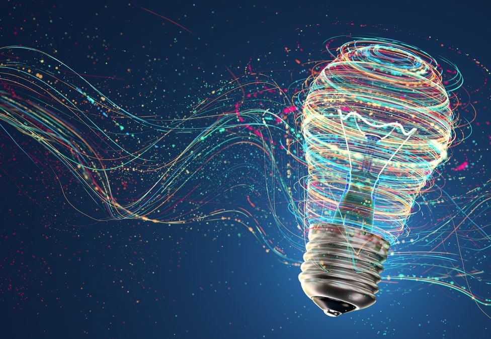 Light bulb with colorful flowing data streams against dark blue background