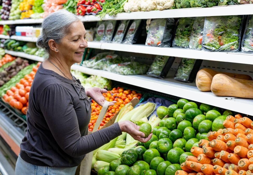 Woman shopping for fresh produce in grocery store