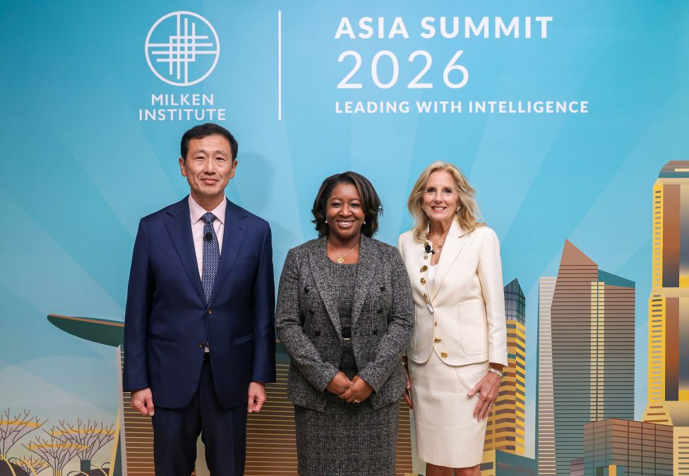 Three business professionals standing together at Asia Summit 2026
