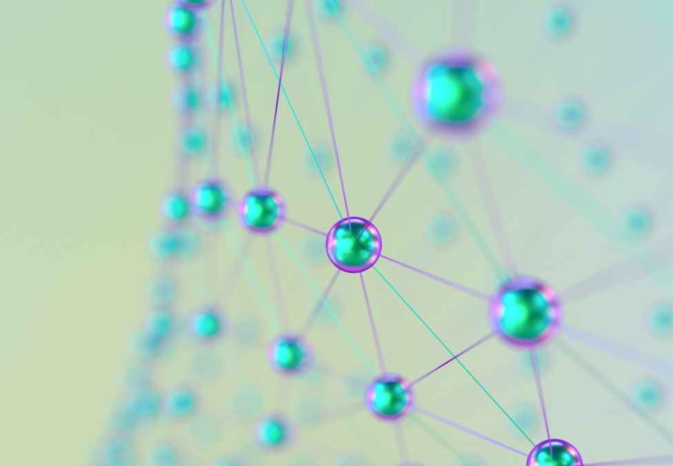 Microscopic view of blue-stained cells connected in a network pattern on pale background